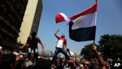 FILE - Supporters of Egypt's ousted President Mohamed Morsi chant slogans during a protest in Ramses Square in downtown Cairo, 2013.