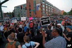 Protesters gather in downtown St. Louis, Sept. 15, 2017, after a judge found a white former St. Louis police officer, Jason Stockley, not guilty of first-degree murder in the death of a black man, Anthony Lamar Smith, who was fatally shot following a high-speed chase.