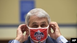 Dr. Anthony Fauci, director of the National Institute for Allergy and Infectious Diseases, adjusts his face mask during a House Subcommittee on the Coronavirus crisis hearing, Friday, July 31, 2020 on Capitol Hill in Washington. (Kevin Dietsch/Pool via AP