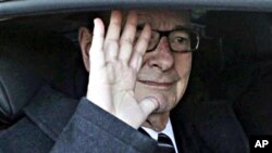 Former French President Jacques Chirac leaves his office in Paris, March 7, 2011
