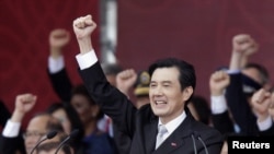 Taiwan's President Ma Ying-jeou raises his fist after giving a speech during National Day celebrations in front of the presidential office in Taipei October 10, 2012.