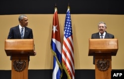 U.S. President Barack Obama, left, and Cuban President Raul Castro hold a joint press conference after meeting at the Revolution Palace in Havana, March 21, 2016.