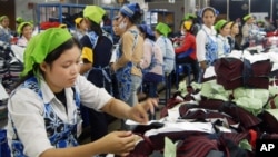 Cambodian garment workers work inside a factory in Phnom Penh, Cambodia, file photo. 