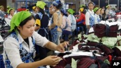 Cambodian garment workers work inside a factory in Phnom Penh, file photo. 