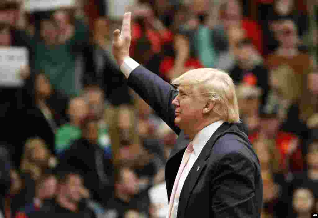 Republican presidential candidate, Donald Trump waves to the crowd during a rally at Radford University in Radford, Virginia, Feb. 29, 2016.