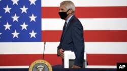 Dr. Anthony Fauci, director of the National Institute of Allergy and Infectious Diseases arrives to participate in a roundtable on donating plasma at the American Red Cross national headquarters on Thursday, July 30, 2020, in Washington. (AP Photo/Evan Vu