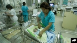 Nurses attend newborn babies at the Maternity hospital in Lima, Peru, Monday, Oct. 31, 2011. (AP Photo/Karel Navarro)