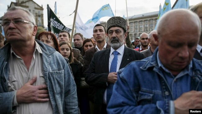 Krım tatarları Stalin deportasiyalarının ildönümünü anır. 18 may, 2015. Sovet hökumətinin başlatdığı kütləvi sürgün zamanı minlərlə adamın həlak olduğu təxmin edilir.