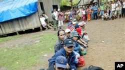 Montagnards from neighbouring Vietnam await registration by United Nations High Commissioner for Refugees staff in Korng village, Ratanakiri province, in 2004.