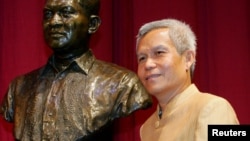 In this August 31, 2005 photo, Sombath Somphone of Laos, winner of Ramon Magsaysay Award for Community Leadership in 2005, poses prior to receiving his award in Manila.