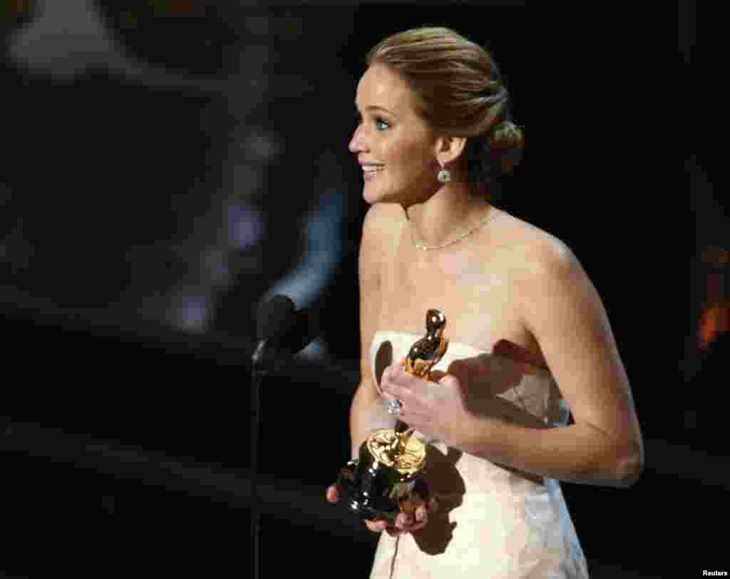 Actress Jennifer Lawrence accepts the award for best actress for her role in "Silver Linings Playbook".