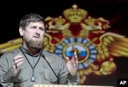 FILE - Chechen regional leader Ramzan Kadyrov speaks at a meeting marking the Interior Ministry Officer Day in Chechnya's provincial capital Grozny, Russia, Tuesday, Nov. 10, 2015.