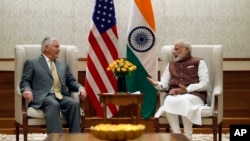 Secretary of State Rex Tillerson listens to Indian Prime Minister Narendra Modi during their meeting at the Prime Minister's residence in New Delhi, India, Oct. 25, 2017.