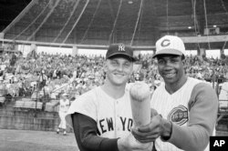 Roger Maris of the N.Y Yankees and Frank Robinson of the Cincinnati Reds pose before an exhibition game in Tampa, Florida, March 26, 1962. Maris was voted the MVP in the American League and Frank Robinson received the National League’s award.