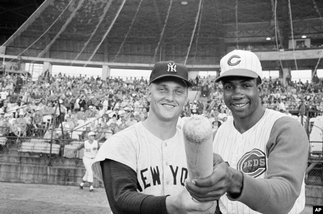 Roger Maris of the N.Y Yankees and Frank Robinson of the Cincinnati Reds pose before an exhibition game in Tampa, Florida, March 26, 1962. Maris was voted the MVP in the American League and Frank Robinson received the National League’s award.