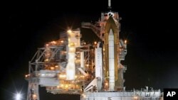 Space shuttle Endeavour is prepared for launch as the Rotating Service Structure (RSS) is rolled back at the launch pad, at Kennedy Space Center in Cape Canaveral, Florida, April 29, 2011