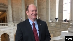 Sen. Chris Coons, a Delaware Democrat, says it's unwise to reduce ranks of diplomatic and development professionals. (M. Bowman/VOA)