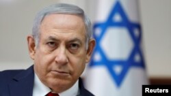 Israel's Prime Minister Benjamin Netanyahu chairs the weekly Cabinet meeting in Jerusalem, Nov. 18, 2018.