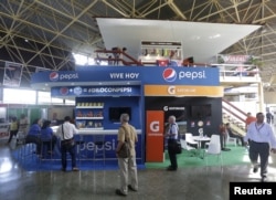 FILE - At the annual Havana International Fair, Cuba’s first trade fair since rapprochement with the United States, the U.S. pavilion includes an exhibit for Pepsi Cola, Nov. 2, 2015. The island nation is eager for more foreign investment.