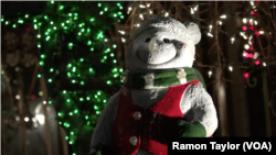 A giant snowman is part of the light display in Dyker Heights, New York.