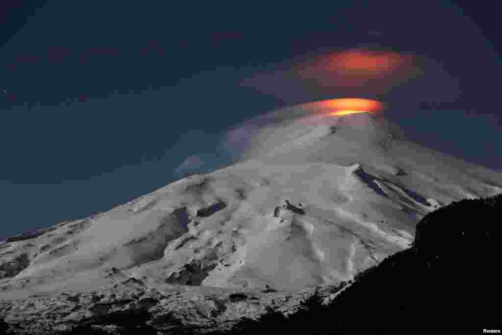 The Villarrica volcano is seen at night from Pucon town, Chile, Sept. 24, 2018.