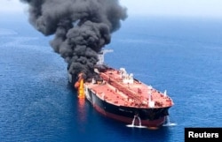 An oil tanker is seen after it was attacked at the Gulf of Oman, June 13, 2019.