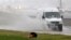 Accumulated rain from what became Tropical Depression Gordon makes for a big splash as this service van makes its way across a frontage road along Interstate 55 in Jackson, Miss., Sept. 5, 2018. Weather forecasts have much of the central part of the state dealing with Gordon's rain until the weekend.
