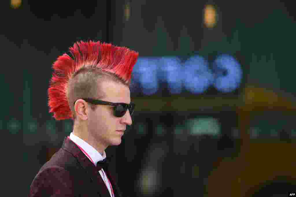 A delegate arrives to attend proceedings on the final day of the Labour Party conference in Liverpool, north west England.