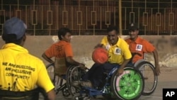 Persons with disabilities enjoy basketball in Karachi. 