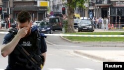 Un policier sur les lieux de la fusillade de Liège, en Belgique, le 29 mai 2018.
