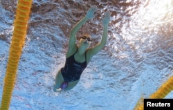 FILE - Syrian refugee team swimmer Yusra Mardini, 18, practices in Rio de Janeiro, Brazil, Jan. 8, 2016.