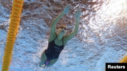 Syrian refugee team swimmer Yusra Mardini swims in Rio de Janeiro before the Olympics.