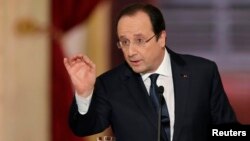 French President Francois Hollande answers a question during a news conference at the Elysee Palace in Paris, Jan. 14, 2014.