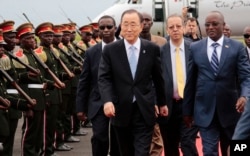 FILE - UN Secretary-General Ban Ki-moon, middle, walks with Burundian First Vice President, Gaston Sindimwso, right, as he arrives in Bujumbura, Burundi, Feb.22, 2016. Ban will return to Burundi to discuss security issues.