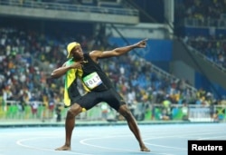 Usain Bolt of Jamaica celebrates winning the gold in the men's 100 meters at the Olympic Games in Rio de Janeiro, Brazil, Aug. 14, 2016.