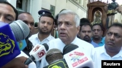 Sri Lanka's Prime Minister Ranil Wickremesinghe speaks to media at St. Anthony's Shrine in Colombo, Sri Lanka, April 21, 2019 in this image obtained from a video.
