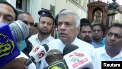 Sri Lanka's Prime Minister Ranil Wickremesinghe speaks to media at St. Anthony's Shrine in Colombo, Sri Lanka, April 21, 2019 in this image obtained from a video. 