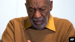 FILE - In this Nov. 6, 2014 file photo, entertainer Bill Cosby pauses during a news conference.