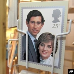A postcard of a commemorative stamp celebrating the wedding of Prince Charles and Lady Diana Spencer in 1981 is displayed outside a philatelists in London