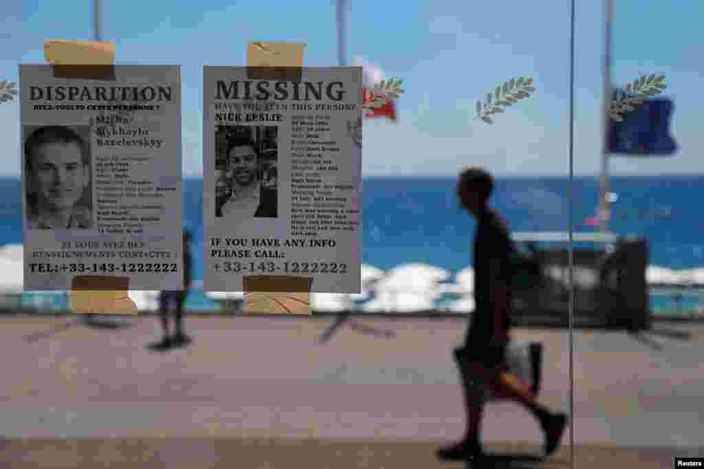 Missing persons leaflets are posted days after a truck attack on the Promenade des Anglais on Bastille Day that killed scores and injured as many in Nice, France.