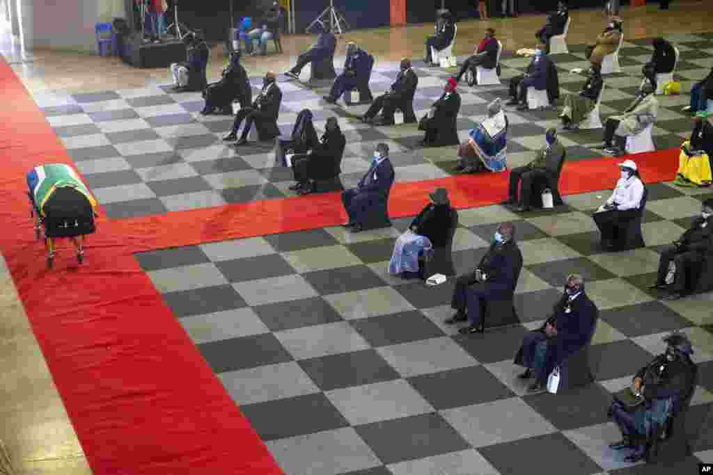 People attend the funeral service of South African anti-apartheid icon Andrew Mlangeni, in Soweto.