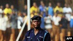 A Ghana policeman watches Egypt's football team's practice in Kumasi, 23 January 2008, during the African Cup of Nations football championship. 