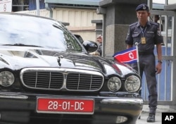 FILE - The car of ambassador of North Korea to Malaysia leaves the forensic department at the hospital in Kuala Lumpur, Malaysia, Feb. 15, 2017.