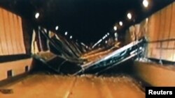 Broken concrete ceiling panels are seen after collapsing inside Sasago Tunnel on the Chuo Expressway, December 2, 2012. 