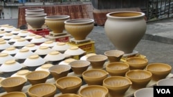 Pots drying in a potter's yard.