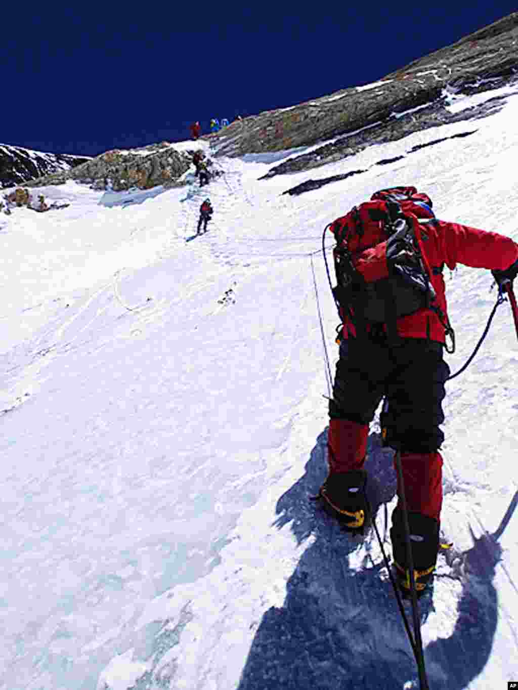 Yuichiro Miura goes through the South Col pass to a camp at 8,000 meters during his attempt to scale the summit of Mount Everest, May 21, 2013. (AP Photo/Miura Dolphins) 