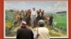 FILE - Gallery visitors view 'Chairman Mao inspects the Guangdong Countryside' by Chinese artist Chen Yanning at the 'Mahjong' exhibition of Contemporary Chinese Art at the Kunsthalle museum in Hamburg, Germany.