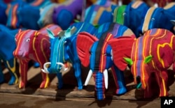 Finished toy animals made from discarded flip-flops are laid out in rows to dry in the sun at the Ocean Sole flip-flop recycling company in Nairobi, Kenya.