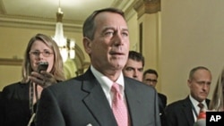 Speaker of the House John Boehner returns to his office after emergency legislation to avert a government default and cut federal spending passed a vote in the House of Representatives, Aug. 1, 2011