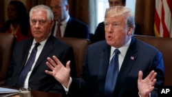 Secretary of State Rex Tillerson listens as President Donald Trump speaks during a cabinet meeting at the White House, Nov. 1, 2017.